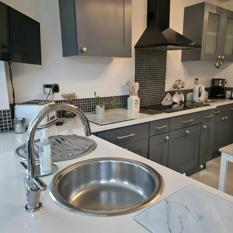 Kitchen wrapping in Norfolk with wrapped cupboards and marble-effect worktops.