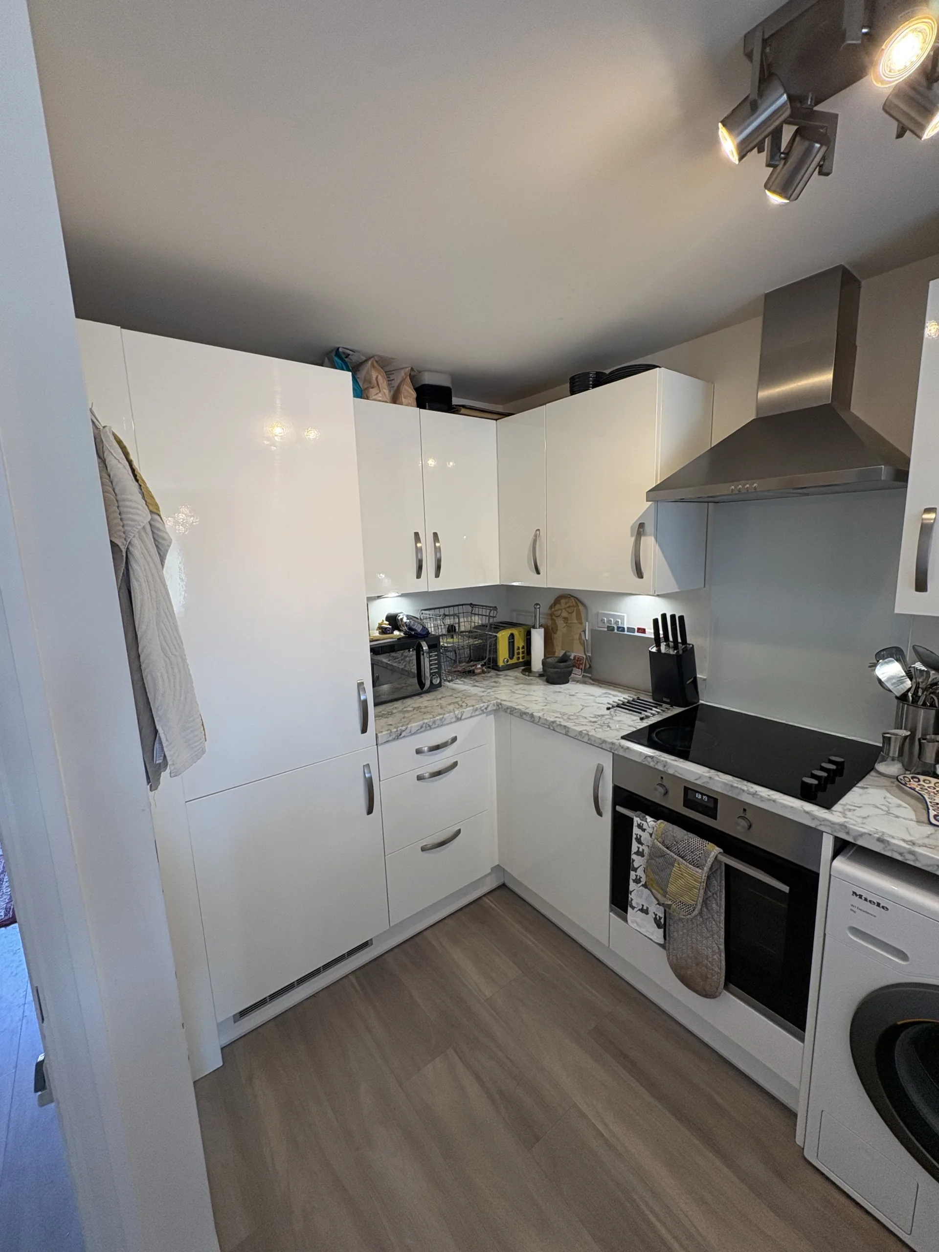Finished white gloss kitchen cupboard wrapping in Rackheath, near Norwich